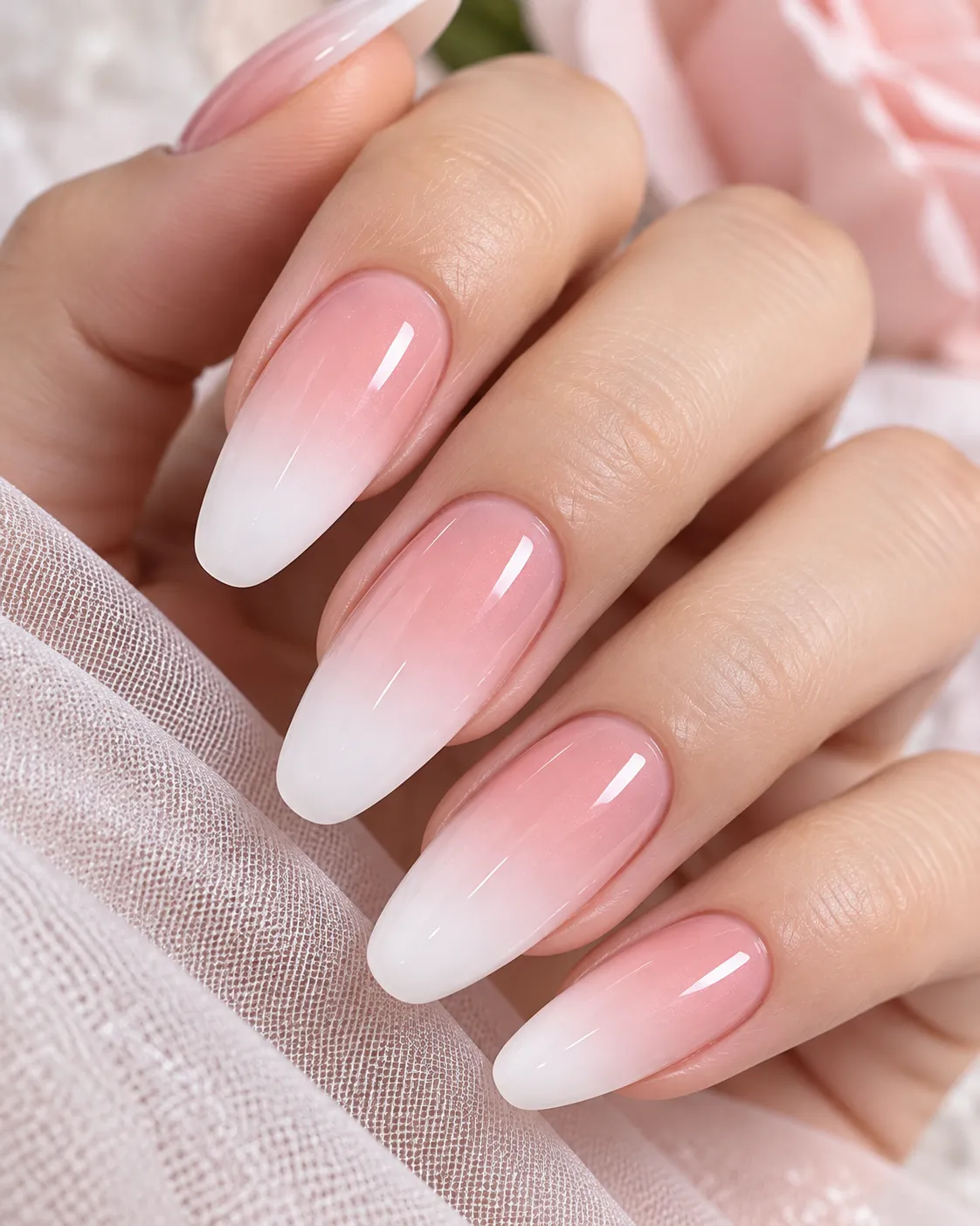 Pink to white gradient ombré nails close-up